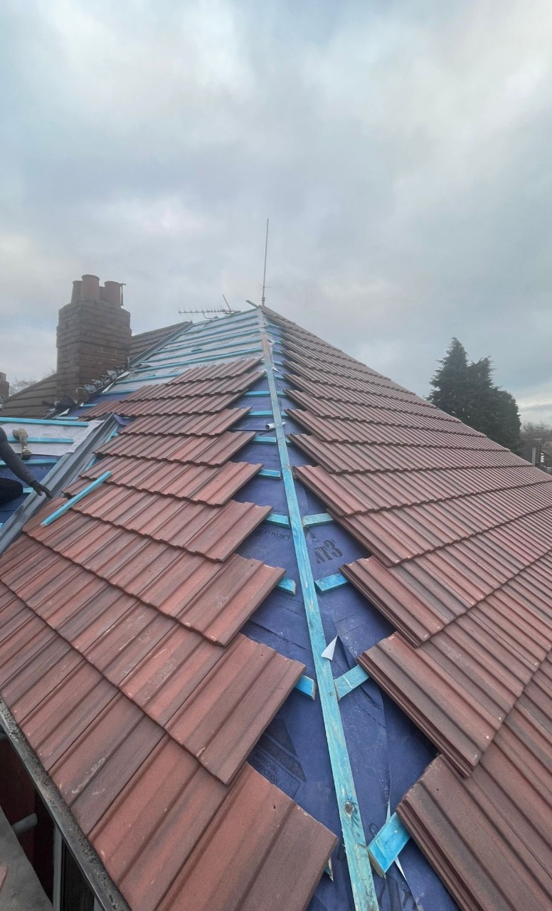 Manchester Roofing and Building Specialists team working on a roof project